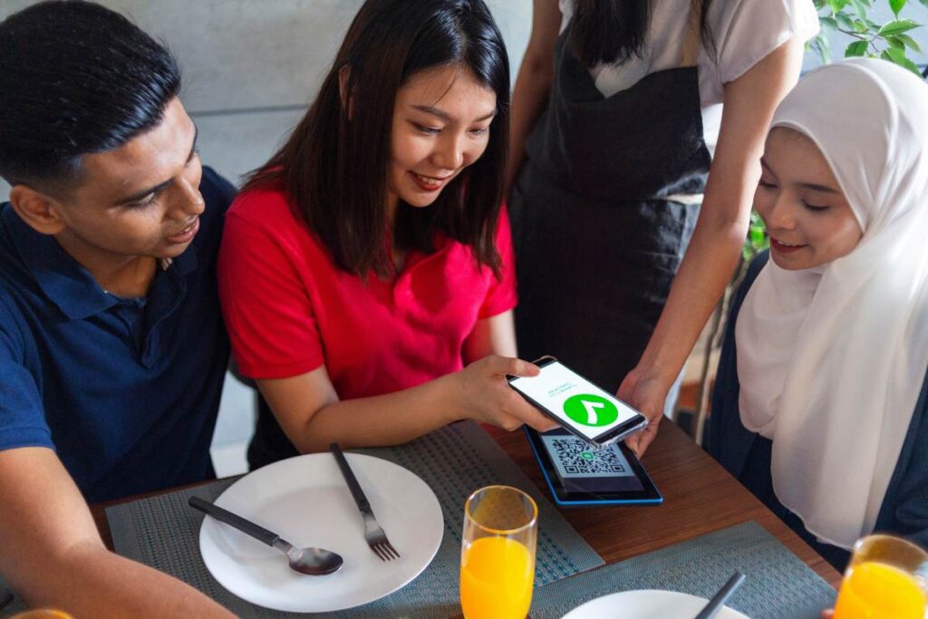 Customer using a QR code and paying with contactless online payment system