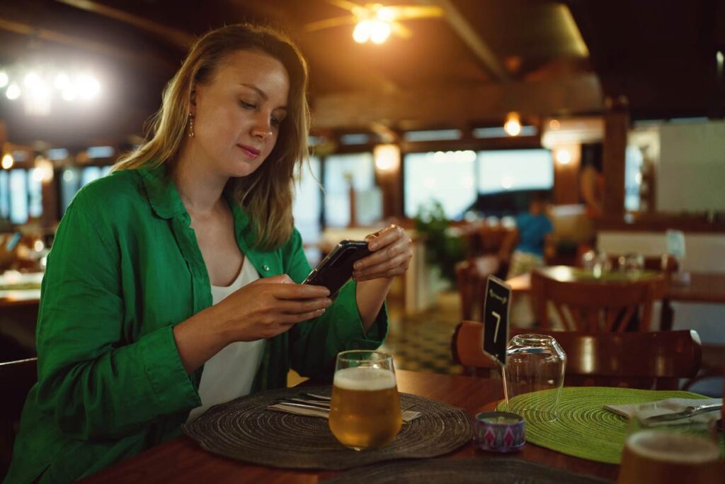 Lady using a QR code to order contactless